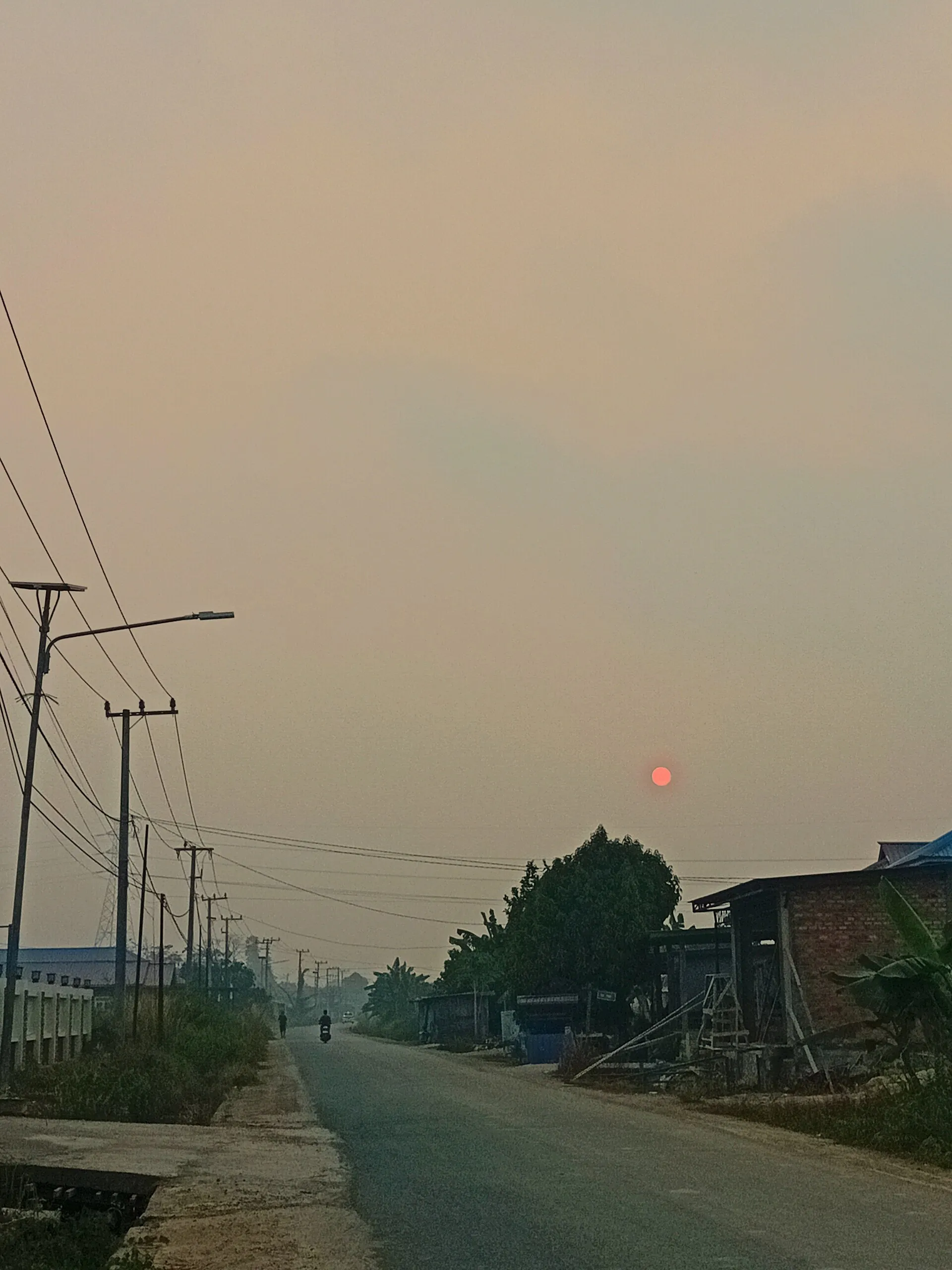 Haze-filled sky and a reddened sunrise in Berau, East Kalimantan